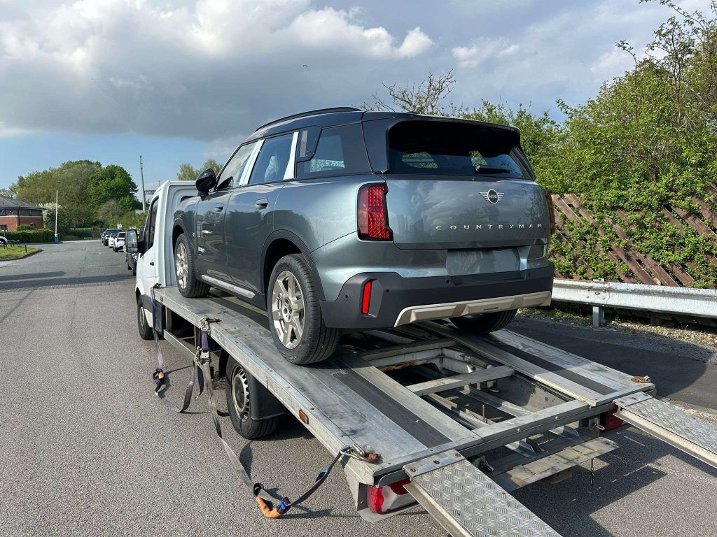 Mini Countryman being loaded on to an AK Car Transport Truck